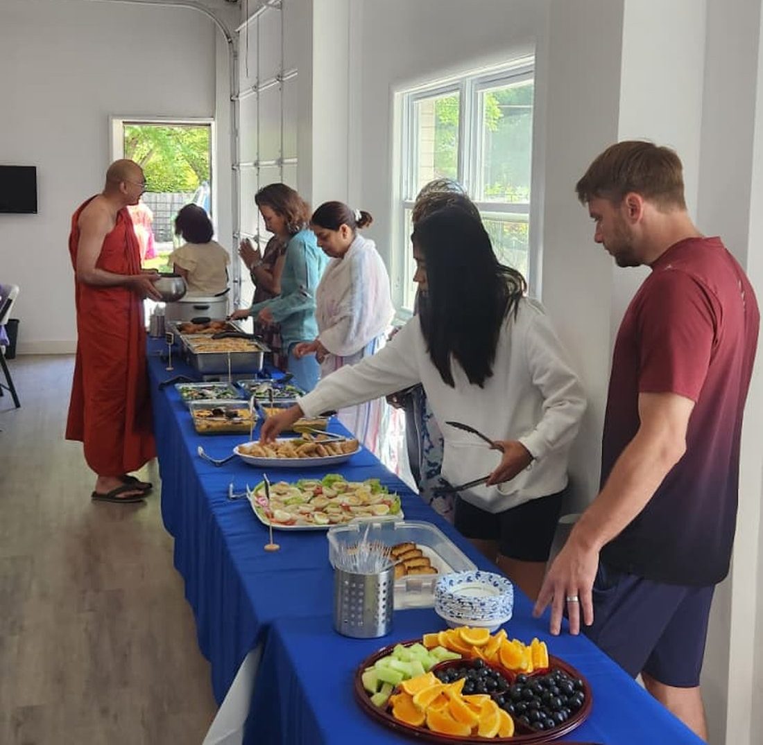Events Calendar 5 Community members sharing a meal together after a meditation session at Buddha Meditation Center DC