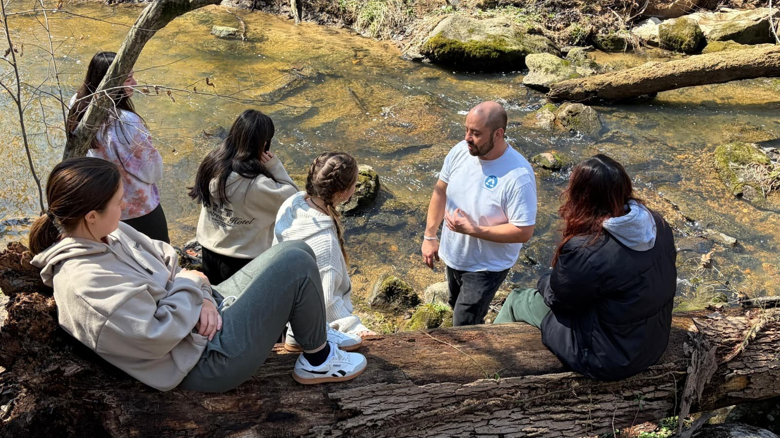 Events Calendar 3 Group Dhamma discussion by a creek during a community meditation walk at Buddha Meditation Center DC