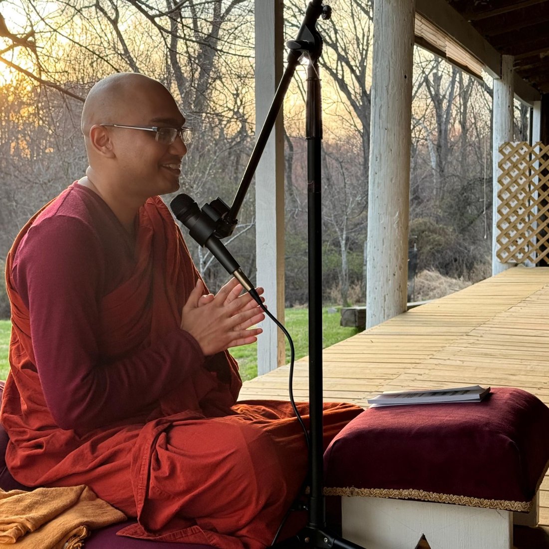 Events Calendar 13 Guided Meditation Session: A monk gives an evening Dhamma talk into a microphone at sunset, Buddha Meditation Center DC