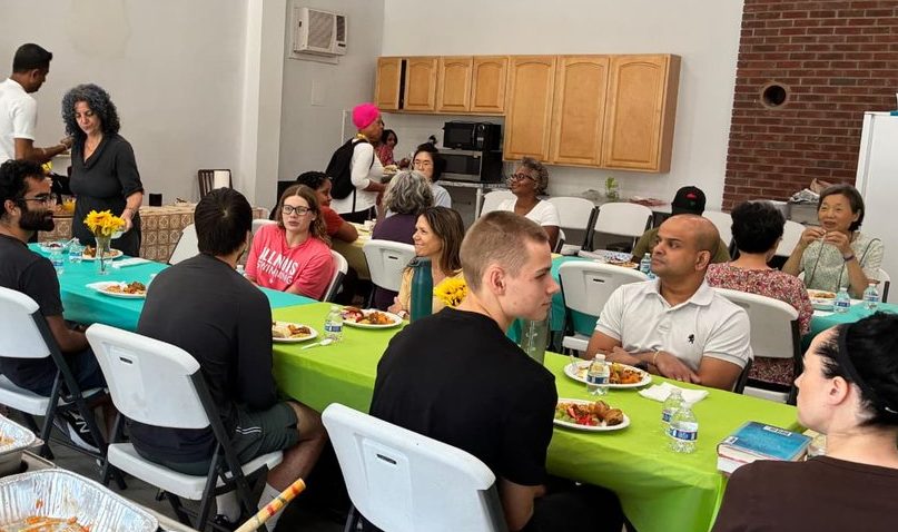 Events Calendar 15 Community members serving themselves food at a shared meal, Buddha Meditation Center DC