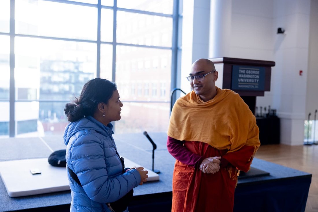 Events Calendar 11 Buddhist Chaplain Amitha Khema speaking with an attendee after a Q&A session at George Washington University